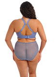 Person wearing a blue bra and gray underwear set on a white background