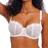 Woman wearing a white lace bra  on a white background