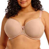 Woman wearing a beige bra on a white background