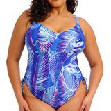 Woman wearing a blue and purple patterned swimsuit on a white background