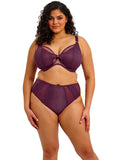 Woman wearing a purple lingerie set on a white background