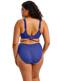 Woman wearing a blue swimsuit on a white background