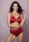 Woman wearing a red lingerie set against a plain background