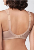 Beige bra worn by a person on a white background
