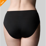 Black high-waisted underwear on a gray background