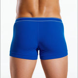 Blue boxer briefs worn by a person on a white background