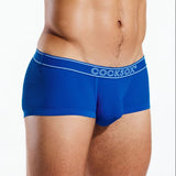 Blue boxer briefs with 'COCKSOX' branding on a white background
