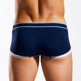 Navy blue trunk briefs with white trim on a white background