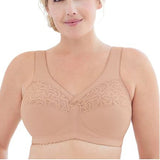 Woman wearing a beige bra with lace detailing on a white background